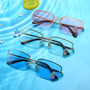 Luxury rimless sunglasses featuring pink, clear and blue lens options displayed on a water-inspired background
