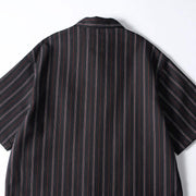 Back detail view of men’s black retro striped loose fit short sleeve casual shirt showing relaxed oversized silhouette and vertical stripe design.
