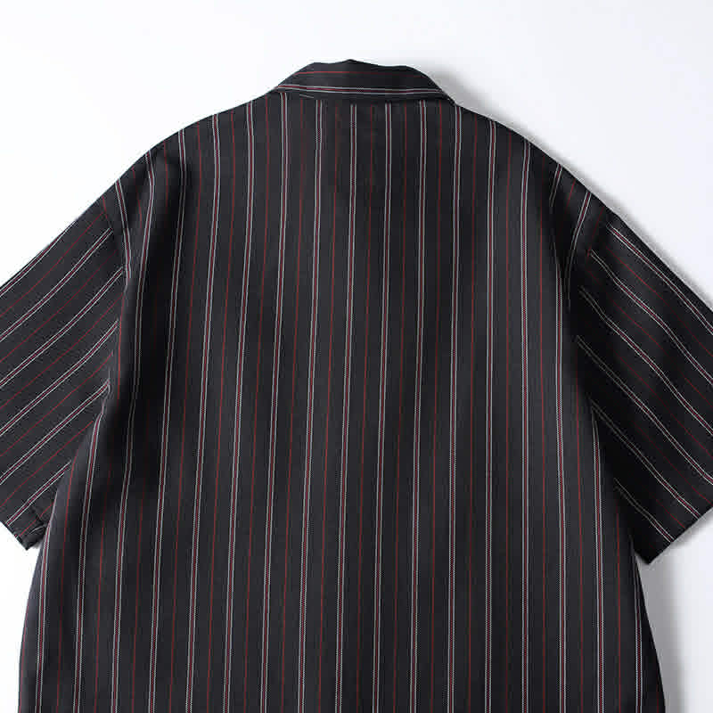 Back detail view of men’s black retro striped loose fit short sleeve casual shirt showing relaxed oversized silhouette and vertical stripe design.
