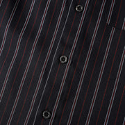 Close-up of front button placket on men’s black retro striped loose fit casual shirt showing premium buttons and stripe alignment.
