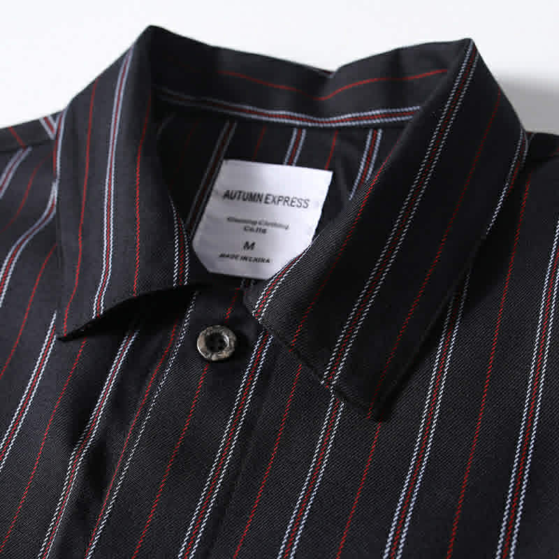 Classic collar detail of men’s black retro striped loose fit short sleeve casual shirt with clean structured design.
