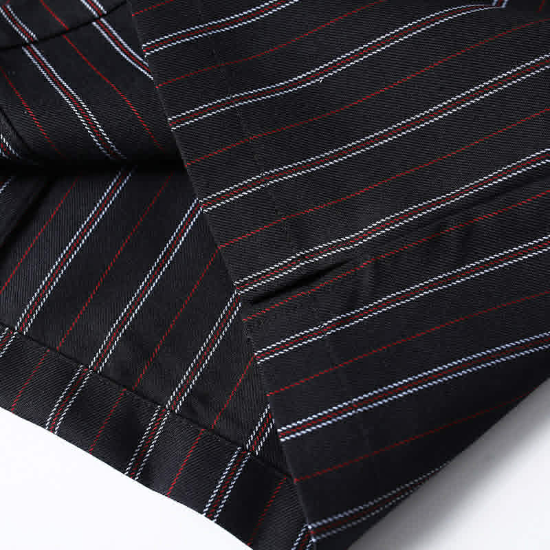 Premium fabric construction detail of men’s black retro striped loose fit casual shirt with retro vertical stripe pattern.
