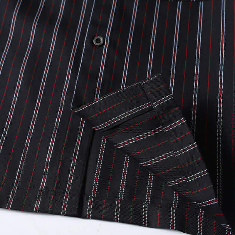 Close-up of the hem finish on a men’s black retro striped loose fit casual shirt with premium stitching and clean construction.
