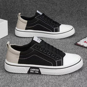 Men’s slip-resistant black canvas sneakers for everyday casual wear.
