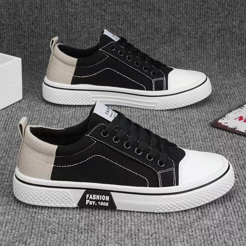Men’s slip-resistant black canvas sneakers for everyday casual wear.
