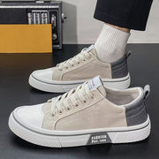 Men’s casual canvas shoes with breathable Korean-style design on foot.
