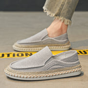 Side view of men’s grey slip-on loafers with soft sole and round toe design