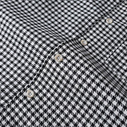 Premium button detail on black and white checkered shirt