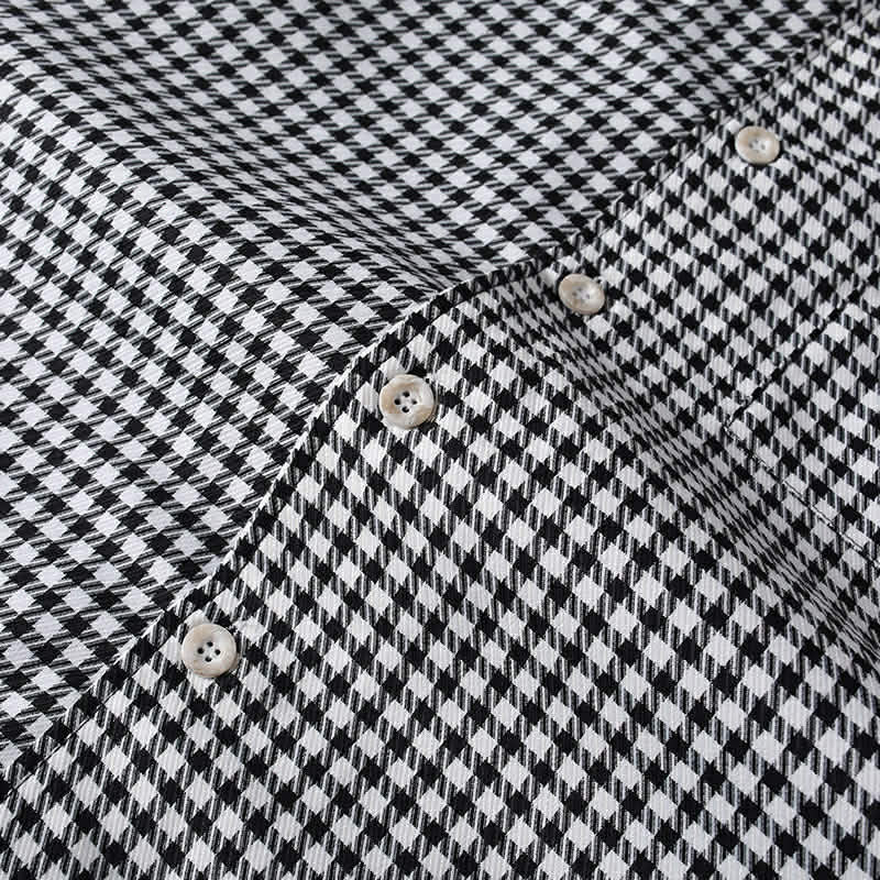 Premium button detail on black and white checkered shirt