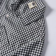 Men's black and white heckered Cuban collar shirt collar detail close-up