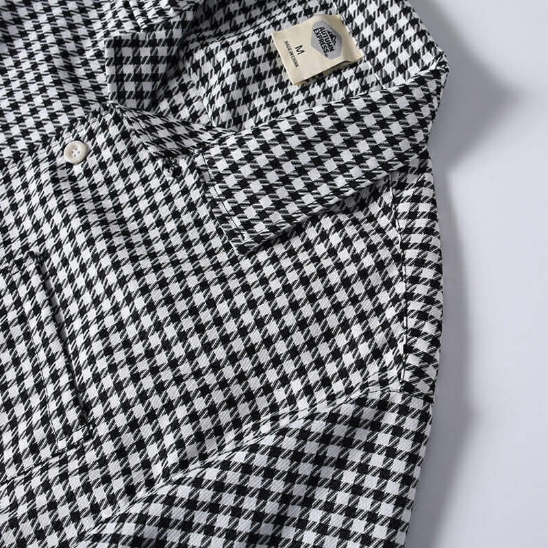 Men's black and white heckered Cuban collar shirt collar detail close-up