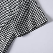 Short sleeve stitching and fabric detail of men's checkered shirt