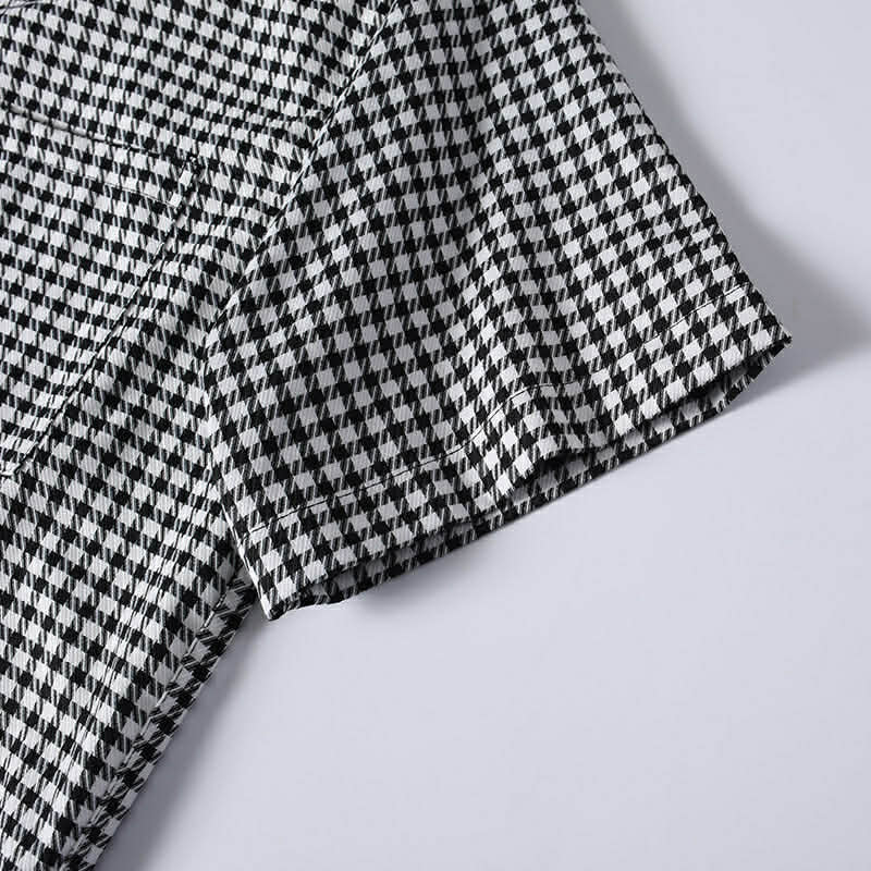 Short sleeve stitching and fabric detail of men's checkered shirt