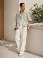 Men’s Cuban collar short sleeve shirt in gray-green color styled for casual summer wear
