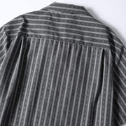 Back pleat detail of gray retro Cuban collar striped shirt designed for comfort, mobility, and relaxed fit styling.
