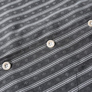 Button placket detail of gray retro Cuban collar striped short sleeve shirt featuring durable buttons and clean finishing.
