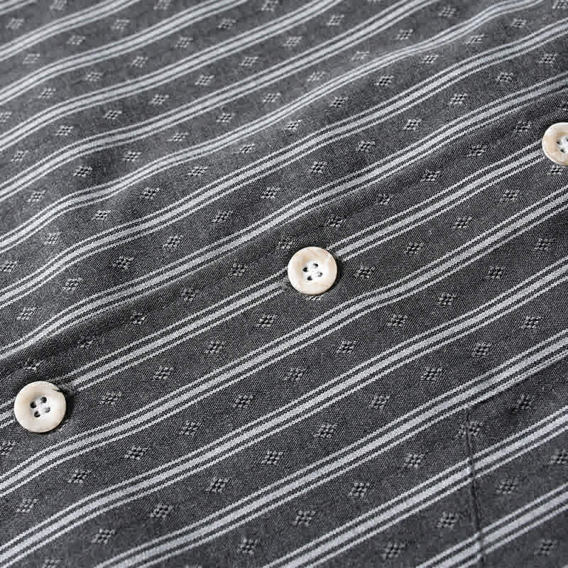 Button placket detail of gray retro Cuban collar striped short sleeve shirt featuring durable buttons and clean finishing.
