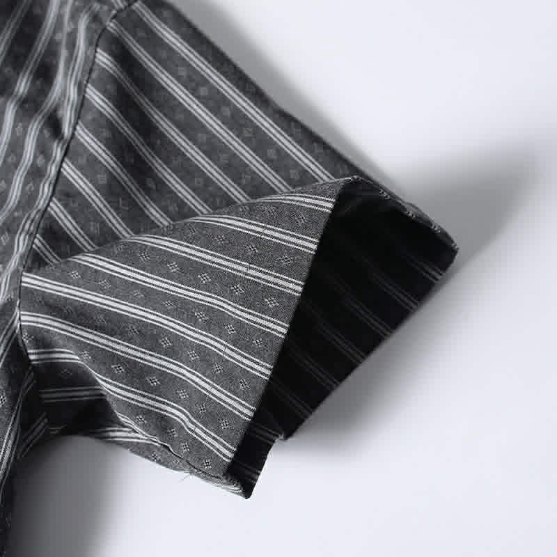 Close-up of sleeve hem on gray retro Cuban collar striped short sleeve shirt featuring premium stitching and relaxed fit construction.
