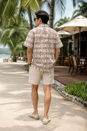 Back view of men’s Hawaiian print Cuban collar shirt with short sleeves and relaxed fit.
