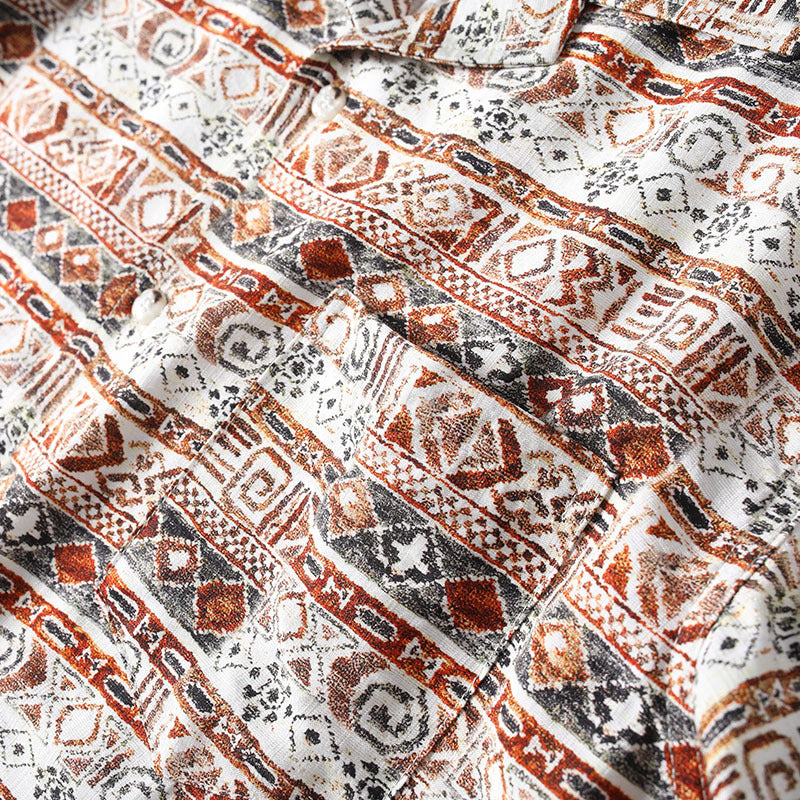 Detailed texture of lightweight Hawaiian print fabric with geometric pattern design.
