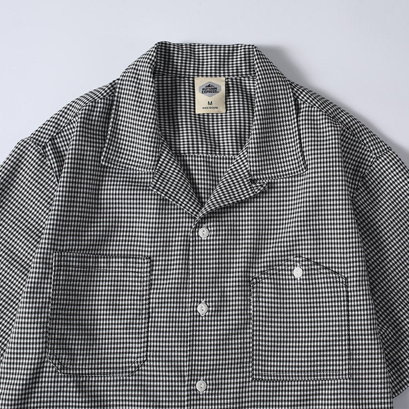 Close-up detail of men’s houndstooth Cuban collar shirt

