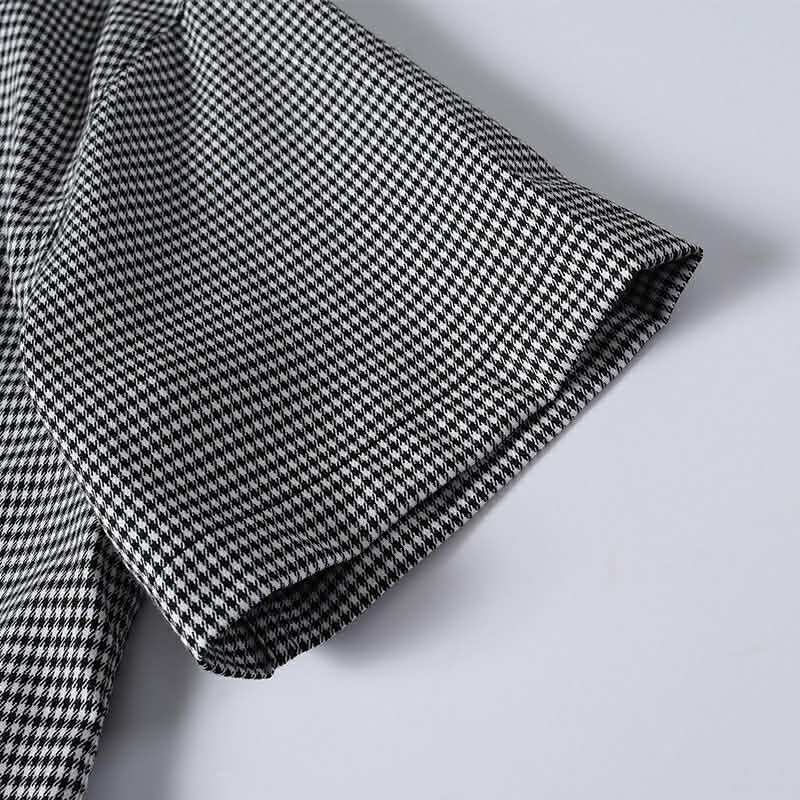 Sort sleeve detail of black and white chek cuban collar shirt