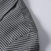 Shoulder stitching detail on black and white check of cuban collar shirt