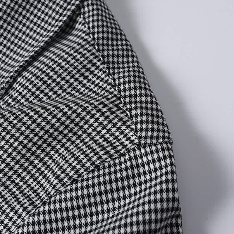 Shoulder stitching detail on black and white check of cuban collar shirt