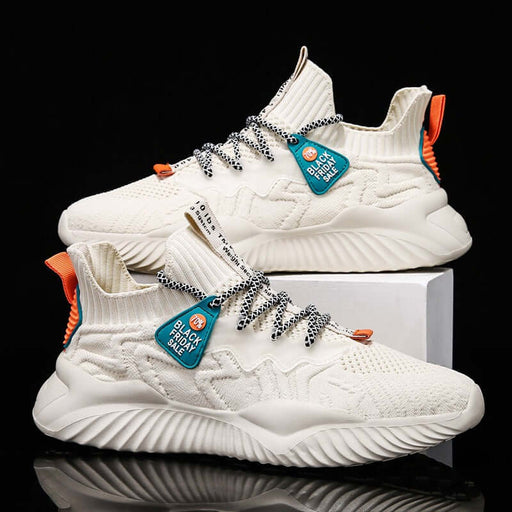 Men’s Lightweight Breathable Sneakers on display, featuring a stylish white design with vibrant orange accents.