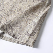 Bottom hem detail of men’s paisley print summer shirt with relaxed loose fit construction.
