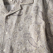 Chest pocket detail on men’s paisley Cuban collar shirt featuring vintage paisley print design.
