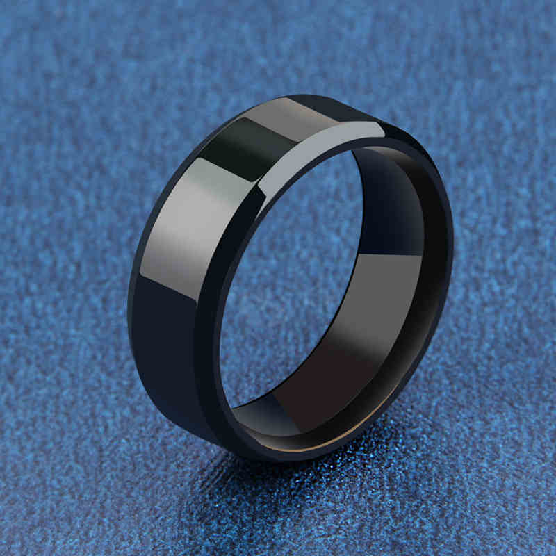 Black minimalist men's ring 8mmpolished band close up.