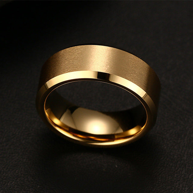 Gold men's ring minimalist classic band close up.