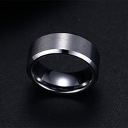 Siver 8mm men's ring minimalist polished band close up.