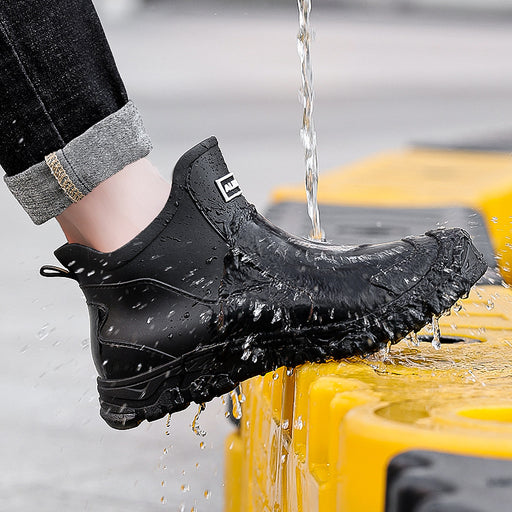 Men’s short-cuff waterproof rain boots in black with anti-slip sole, designed for wet weather and outdoor use