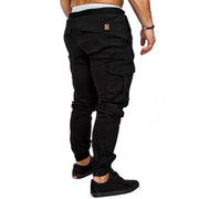 Back view of slim fir cargo joggers for men, featuring a fitted design and multiple pockets in black color.