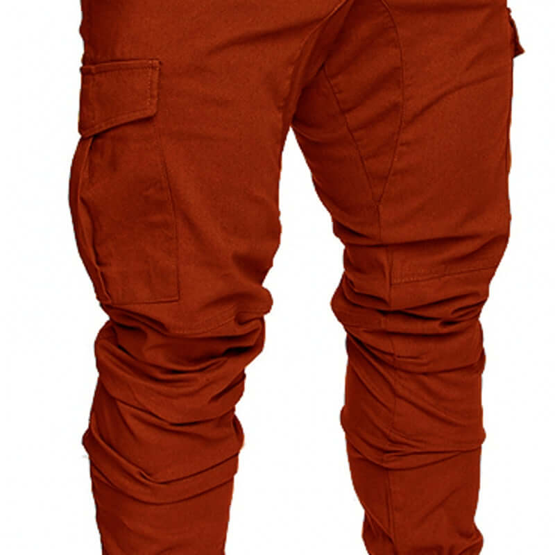 slim fir cargo joggers for men in vibrant rust color with cargo pockets and stylish design.