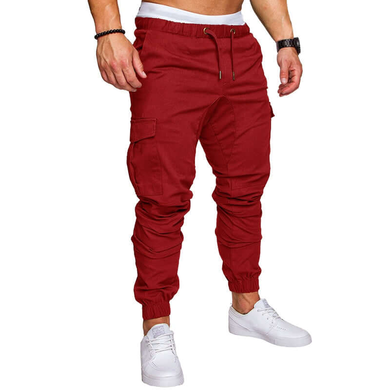 slim fir cargo joggers for men in red color, featuring elastic cuffs and side pockets, styled for casual wear.