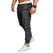 Slim fir cargo joggers for men in dark gray, featuring side pockets and elastic cuffs, styled with white sneakers.