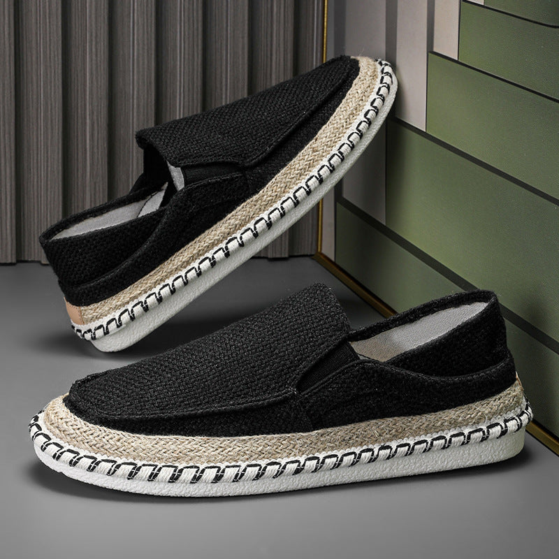 Black men’s slip-on loafers featuring breathable fabric and lightweight driving shoe design
