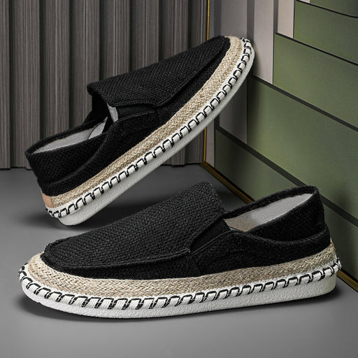 Black men’s slip-on loafers featuring breathable fabric and lightweight driving shoe design