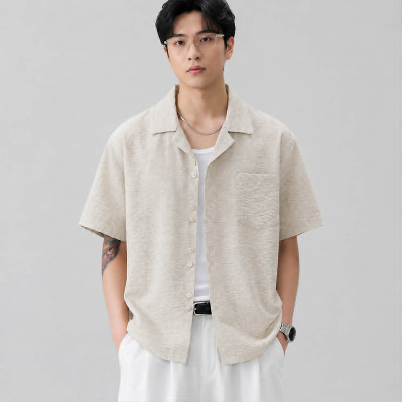 Front view of men's textured apricot Cuban collar short sleeve shirt with relaxed summer fit.
