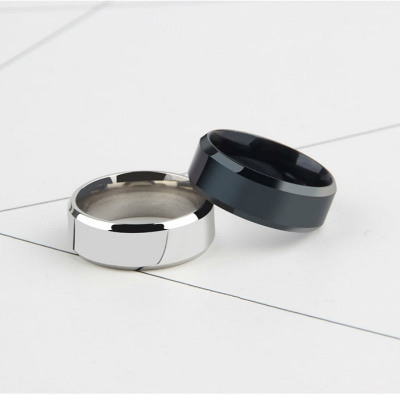 minimalist men7s rings silver and black 8mm on white background.