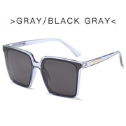 Oversized square sunglasses for women with gray frame and black gray tinted lenses
