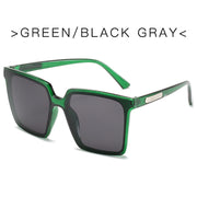 Oversized square sunglasses for women with transparent green frame and black gray UV protection lenses
