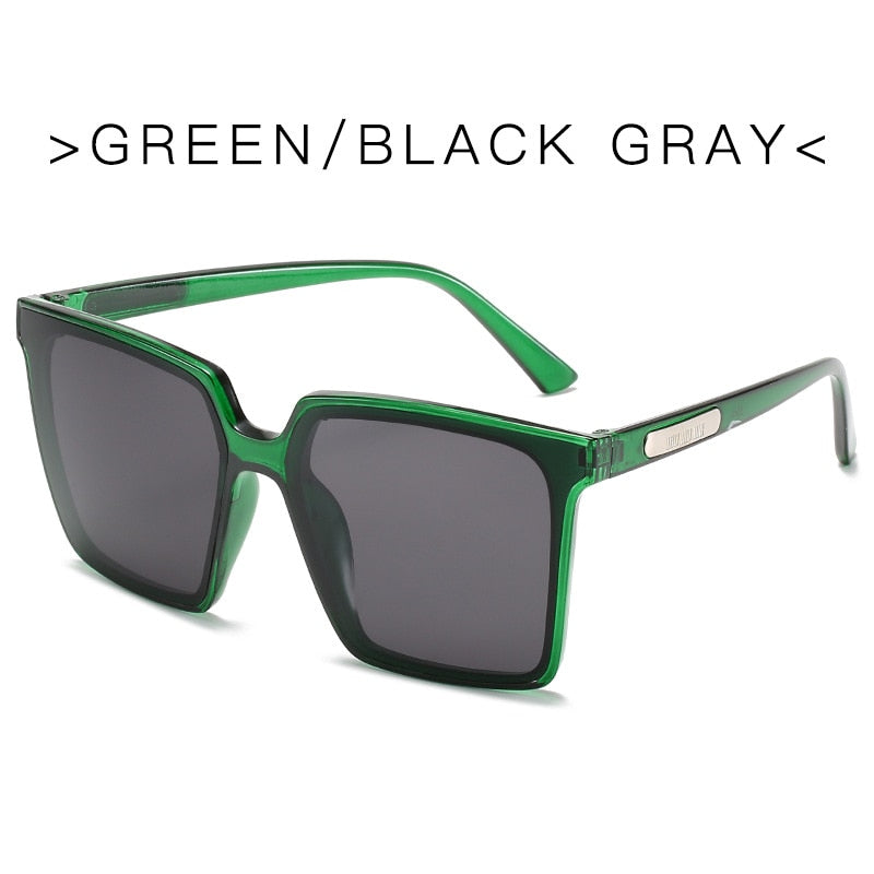 Oversized square sunglasses for women with transparent green frame and black gray UV protection lenses
