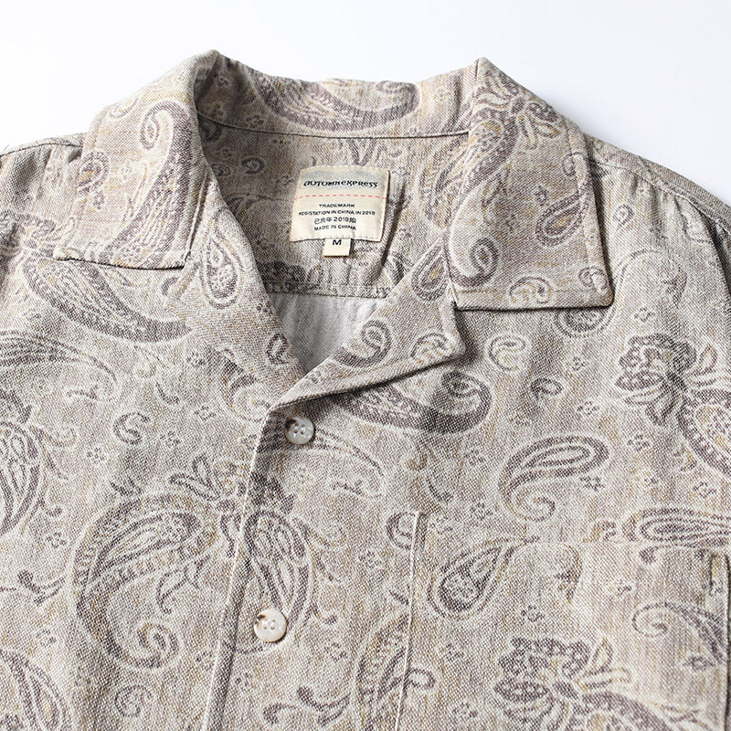 Close-up detail of men’s paisley print Cuban collar shirt
