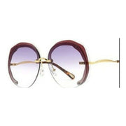 Red double grey rimless oversized cut lens sunglasses with gradient lenses and elegant gold metal temples.
