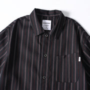 Close-up detail of retro striped shirt collar and pocket
