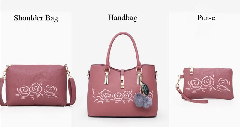 3-piece pink rose embroidery bag set featuring a handbag, shoulder bag, and matching purse with gold-tone hardware and decorative pom pom charm.
